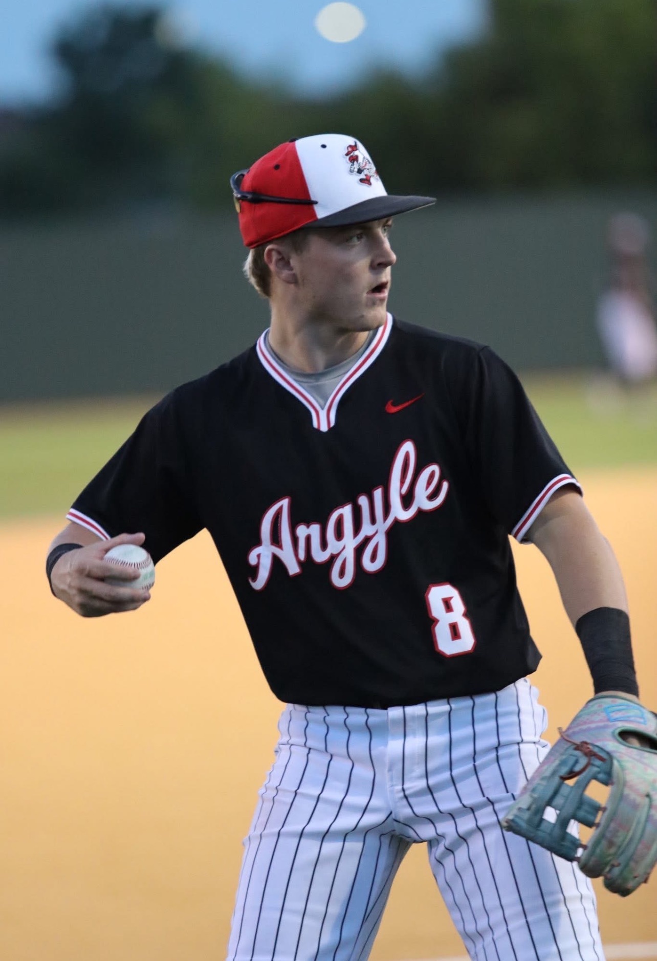 Brodey McConnico, baseball hitting instructor at Train Station Baseball Academy in Argyle, TX, in Argyle Eagles uniform number 8 fielding on the diamond